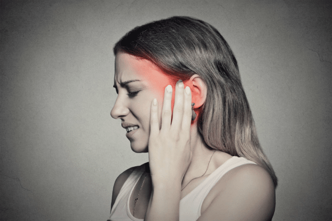 A yound woman from New York suffers from ear and head pain due to her tinnitus.